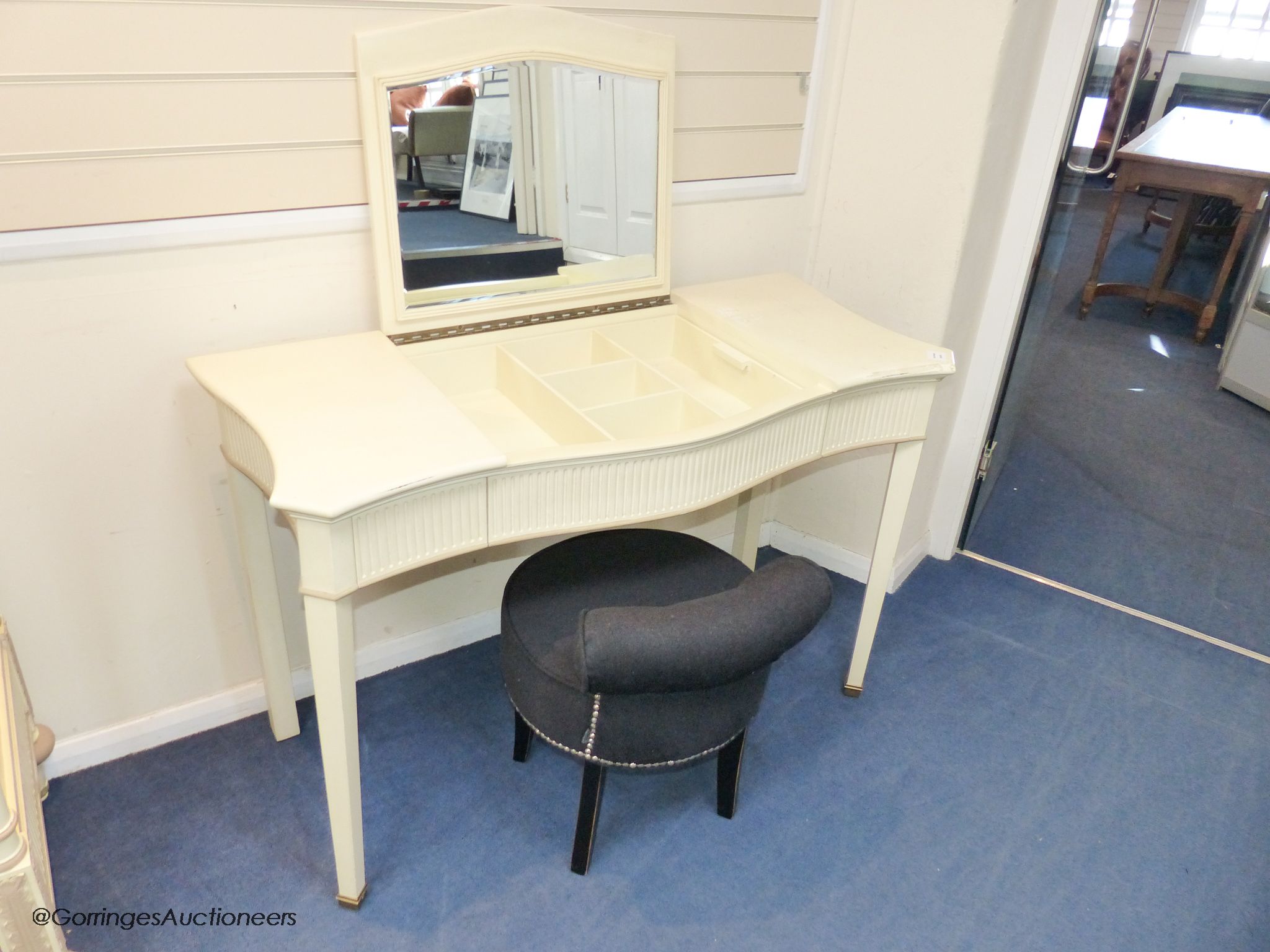 A cream and parcel gilt 'eclectic' dressing table by And So To Bed, 120 cm wide, 54cm deep, 77 cm high, together with an Eichholtz stool